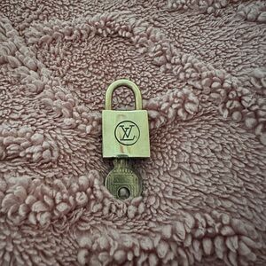 #217 Louis Vuitton Gold Padlock with Key 200 series.